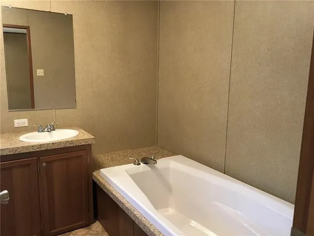 a bathroom with a sink and a bathtub