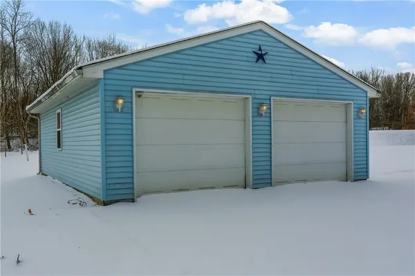 a view of a house with a snow in front of it