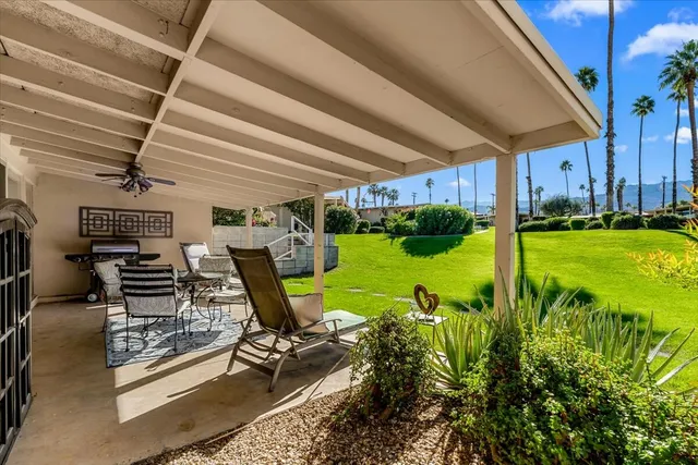 a view of a room with chairs and a table