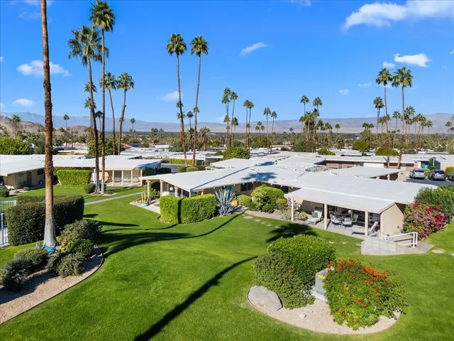 a view of a swimming pool and outdoor seating