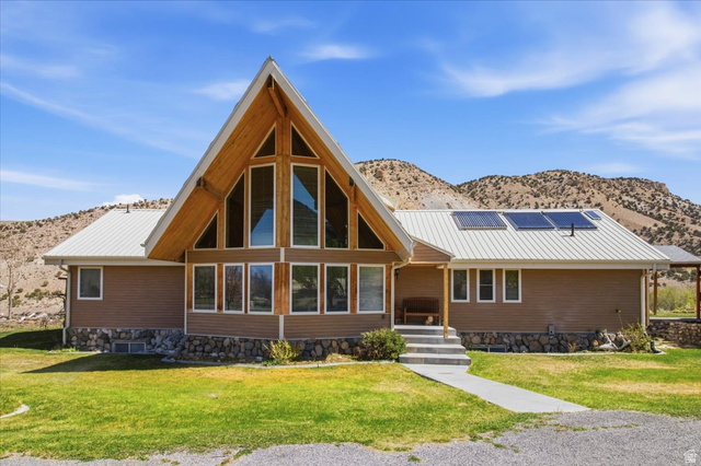 811 East Canyon Road Mayfield, UT 84643 - Photo 2 of 57 A-frame architectural style featuring a striking window wall, wood-finish gables, and a metal roof