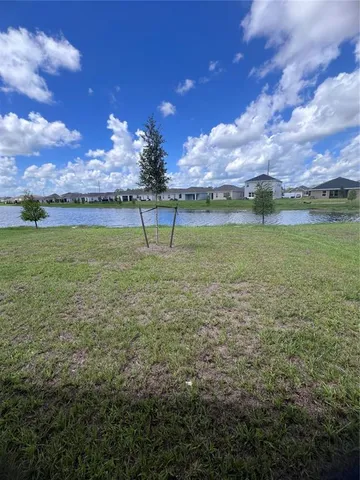 a view of a golf course with a lake