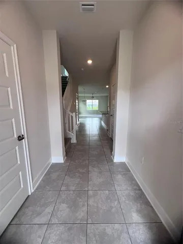 a view of a hallway with seating area