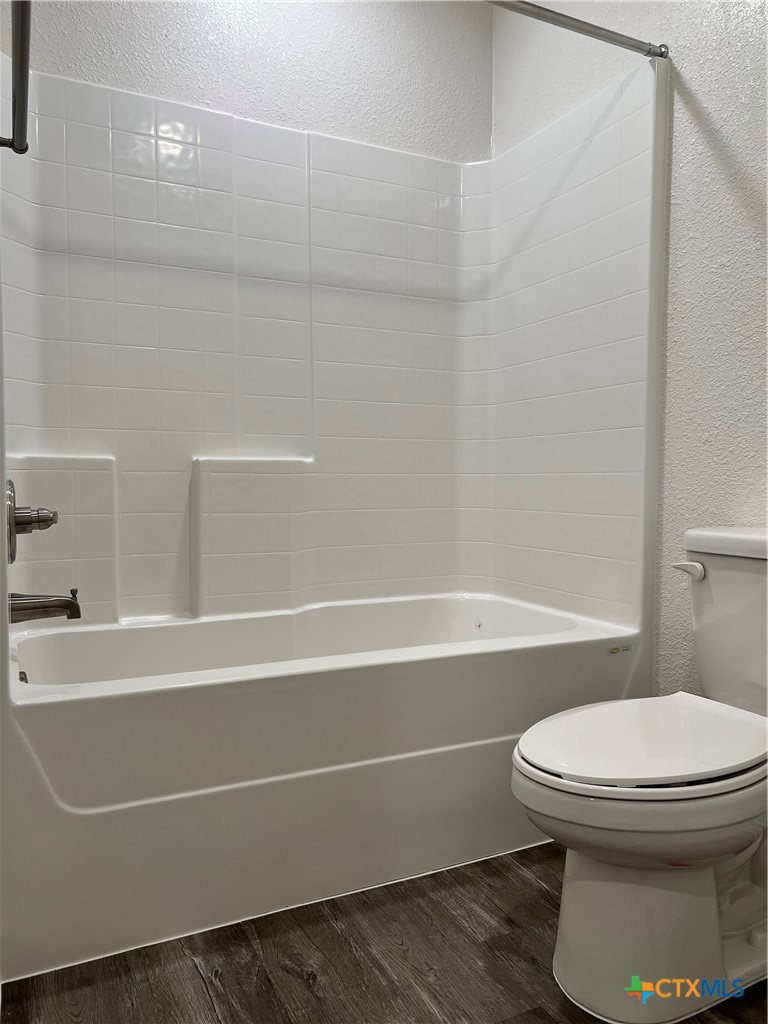 306 Dolphin Drive Temple, TX 76501 - Photo 11 of 16 a bathroom with a toilet and a bathtub