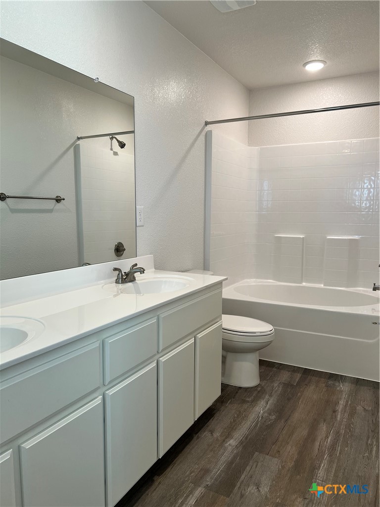 306 Dolphin Drive Temple, TX 76501 - Photo 13 of 16 a bathroom with a toilet a sink and a bathtub