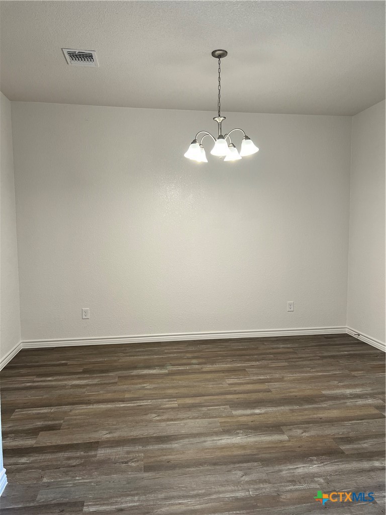 306 Dolphin Drive Temple, TX 76501 - Photo 6 of 16 a view of an empty room with a chandelier