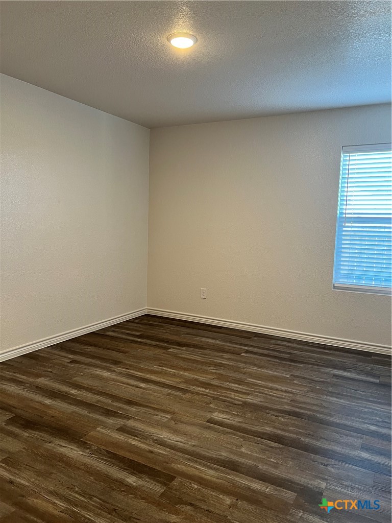 306 Dolphin Drive Temple, TX 76501 - Photo 8 of 16 wooden floor in an empty room