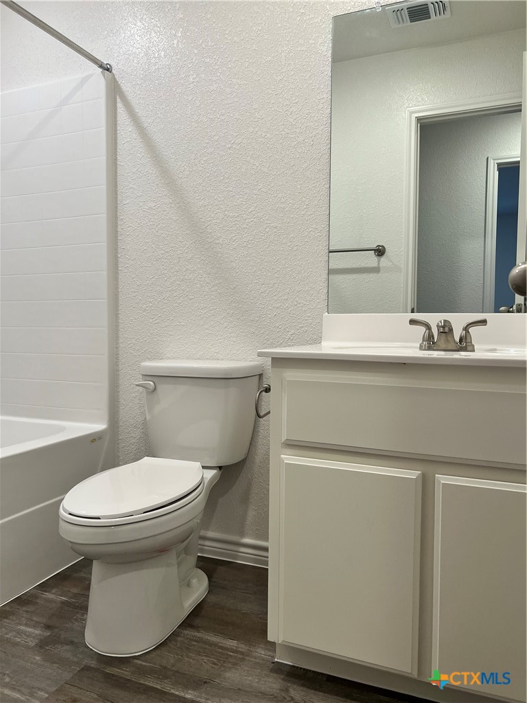 306 Dolphin Drive Temple, TX 76501 - Photo 10 of 16 a bathroom with a sink toilet and mirror