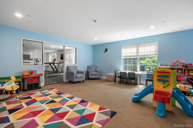 a very nice looking room with furniture and a window