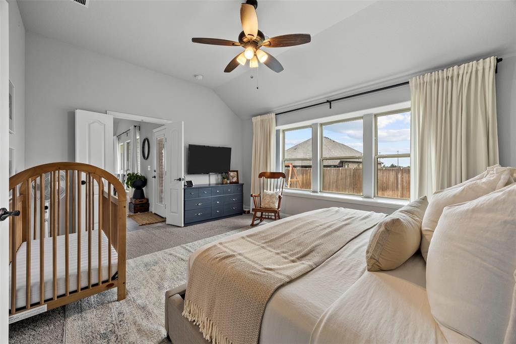 1084 Imperial Eagle Road Alvarado, TX 76009 - Photo 23 of 39 a bedroom with a bed a flat tv screen and a dresser