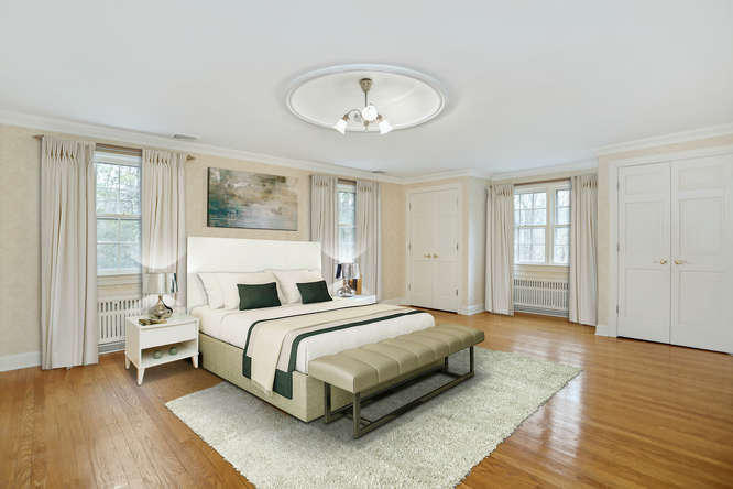65 Nursery Road New Canaan, CT 06840 - Photo 12 of 37 a bedroom with a bed and a chandelier
