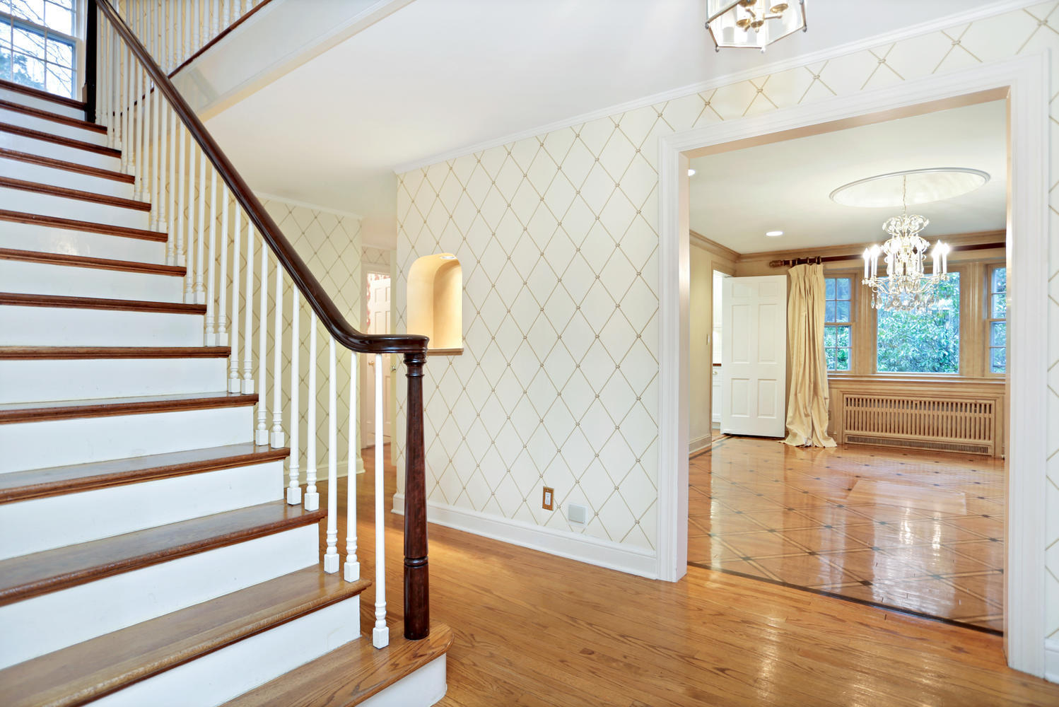 65 Nursery Road New Canaan, CT 06840 - Photo 2 of 37 a view of a hallway with wooden floor and staircase