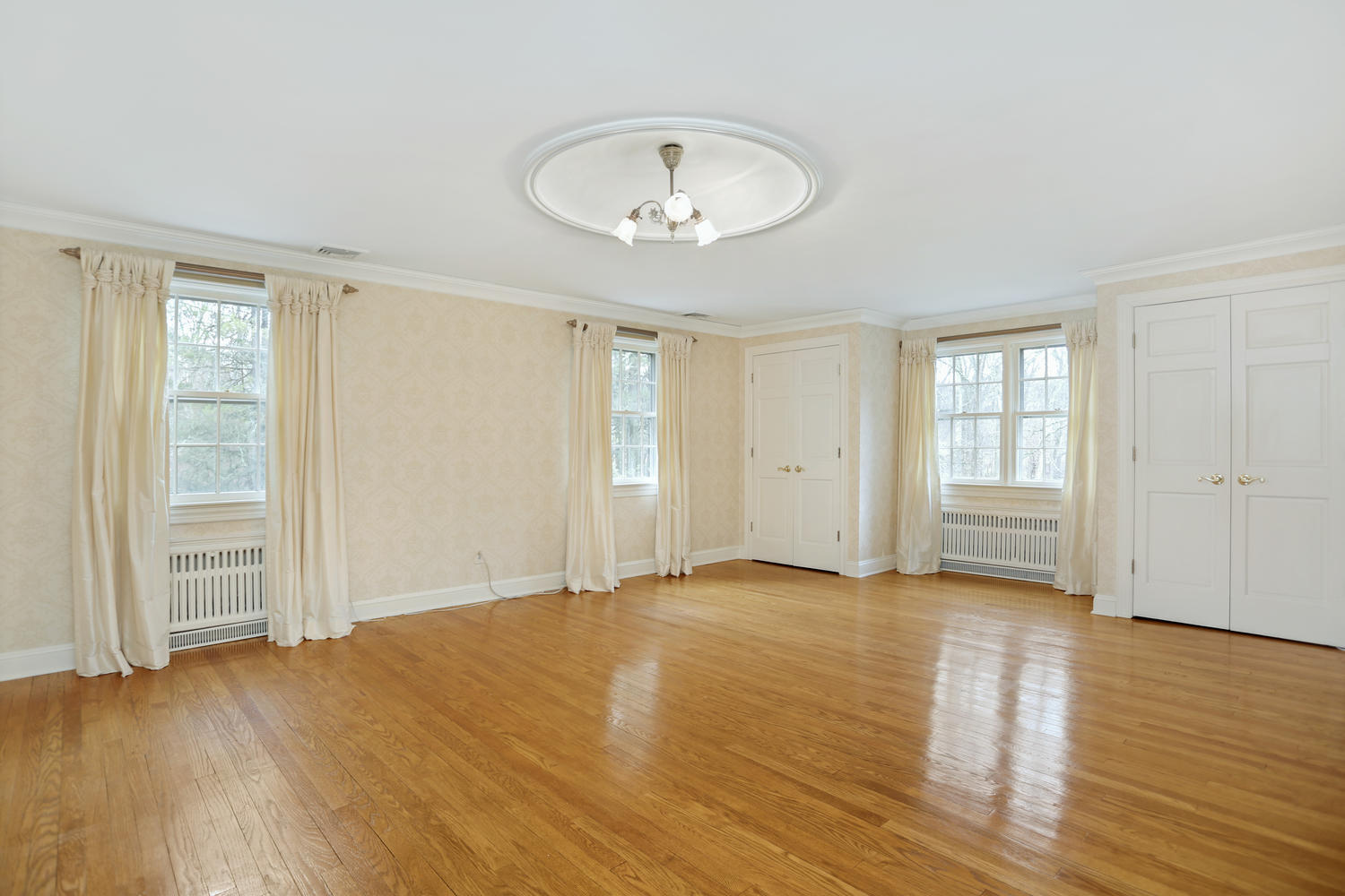 65 Nursery Road New Canaan, CT 06840 - Photo 21 of 37 an empty room with wooden floor and windows