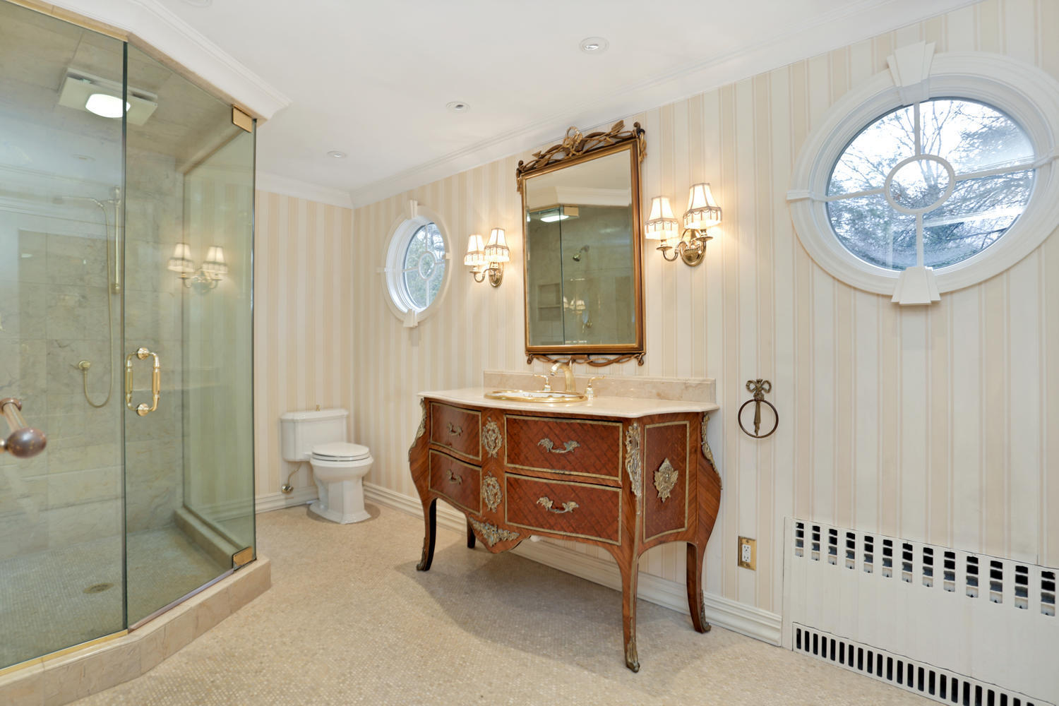65 Nursery Road New Canaan, CT 06840 - Photo 22 of 37 a bathroom with a sink a toilet and a mirror
