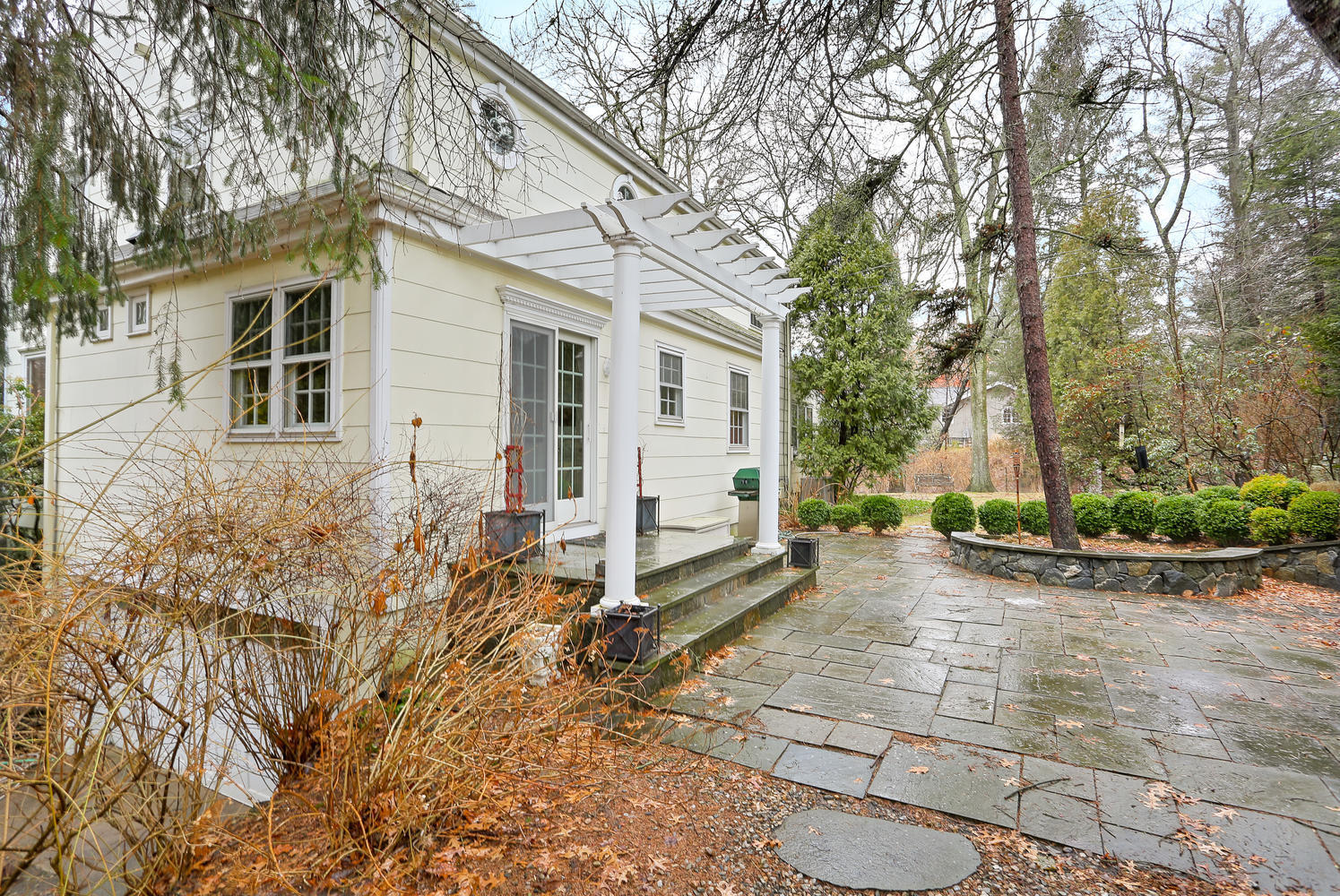 65 Nursery Road New Canaan, CT 06840 - Photo 28 of 37 a view of a house with backyard and sitting area