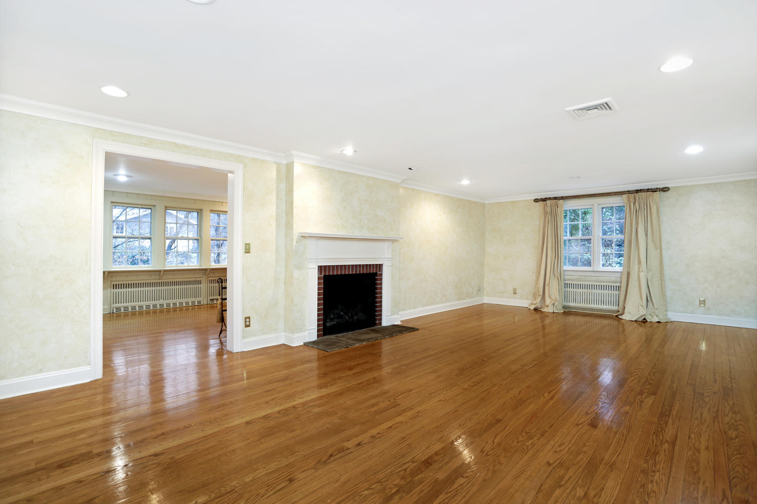 65 Nursery Road New Canaan, CT 06840 - Photo 5 of 37 a view of empty room with wooden floor and fireplace