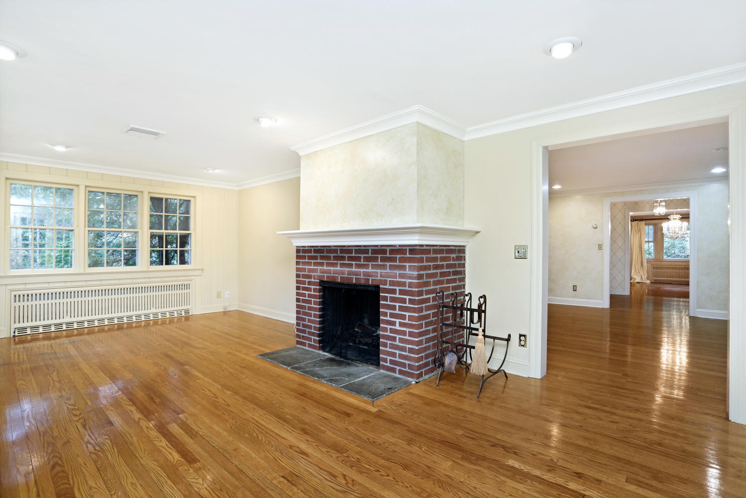 65 Nursery Road New Canaan, CT 06840 - Photo 8 of 37 a view of an empty room with wooden floor fireplace and a window