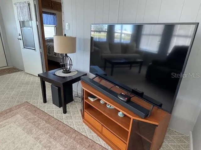 a bedroom with a bed and a view of en suite bathroom