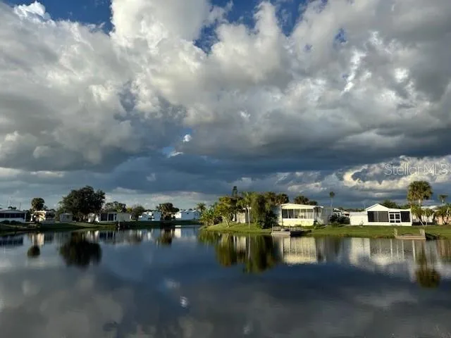 a dining room with furniture window and outside view
