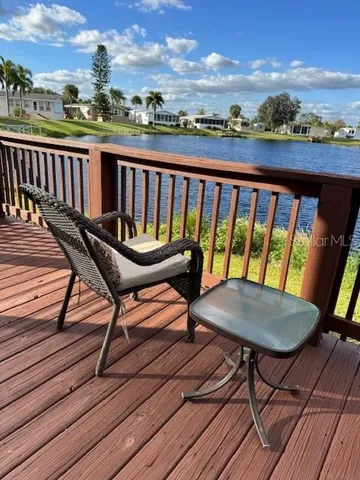 a view of a backyard with sitting area