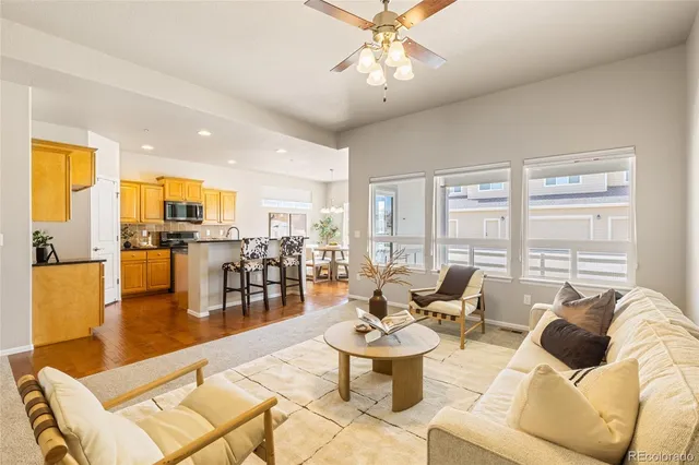 a kitchen with granite countertop a sink a counter top space appliances and cabinets
