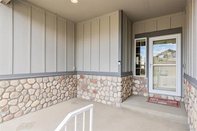 a view of a house with wooden fence