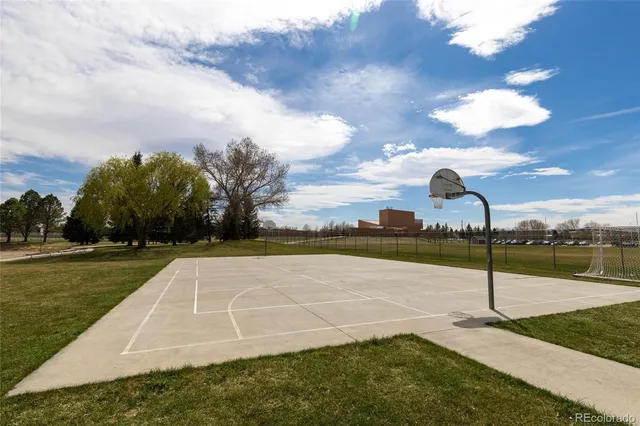 a view of a yard with fountain in front of it