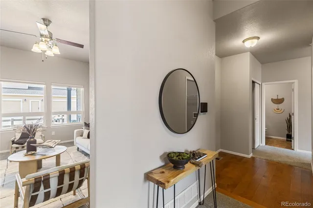a view of a livingroom with furniture and a large window