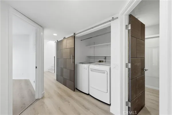 a bathroom with a double vanity sink and mirror