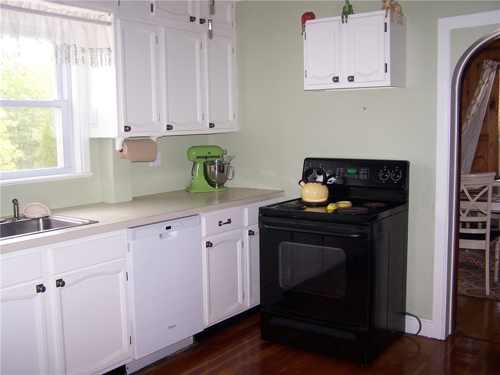 4 Diamond Hill Road Hopkinton, RI 02808 - Photo 26 of 40 looking into kitchen from exit foyer...dining room to the right...