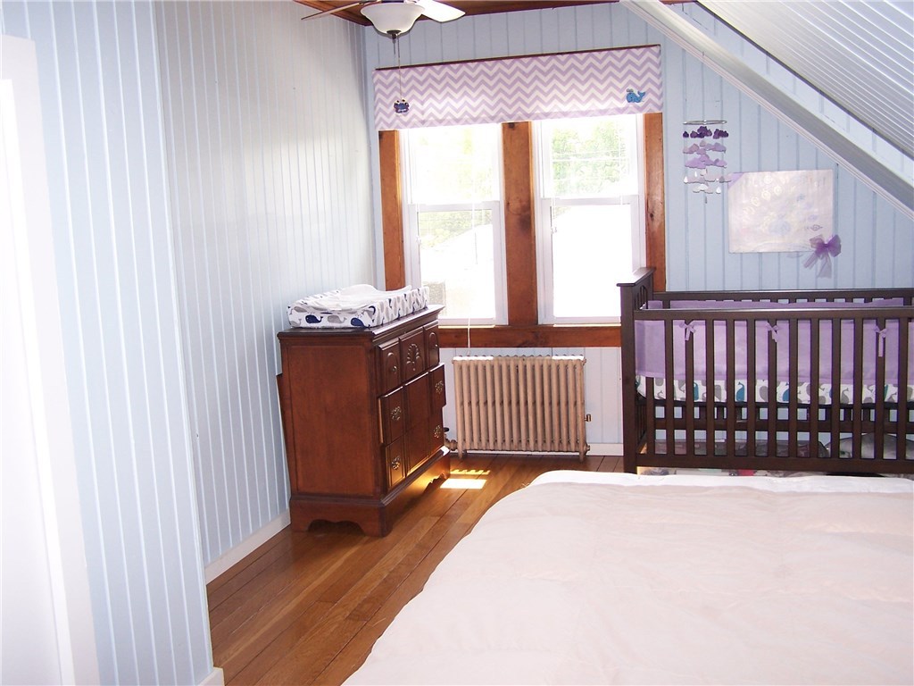 4 Diamond Hill Road Hopkinton, RI 02808 - Photo 33 of 40 one bedroom currently used as a nursery with room for baby to grow! Wood walls partially painted a soft blue...