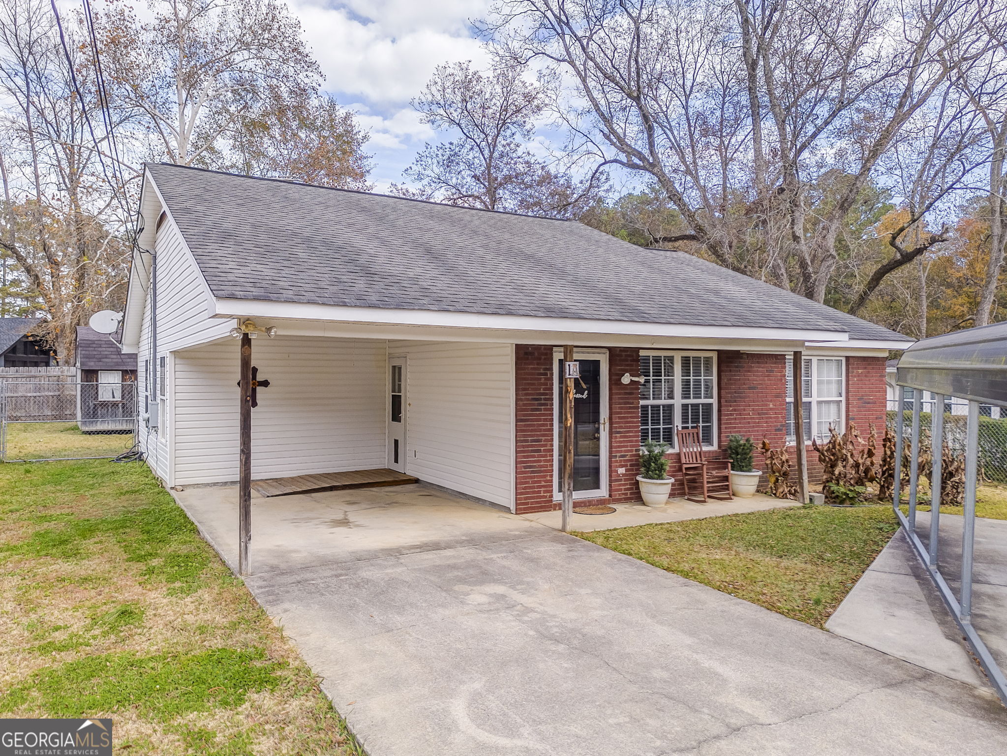 a view of a yard in front view of a house