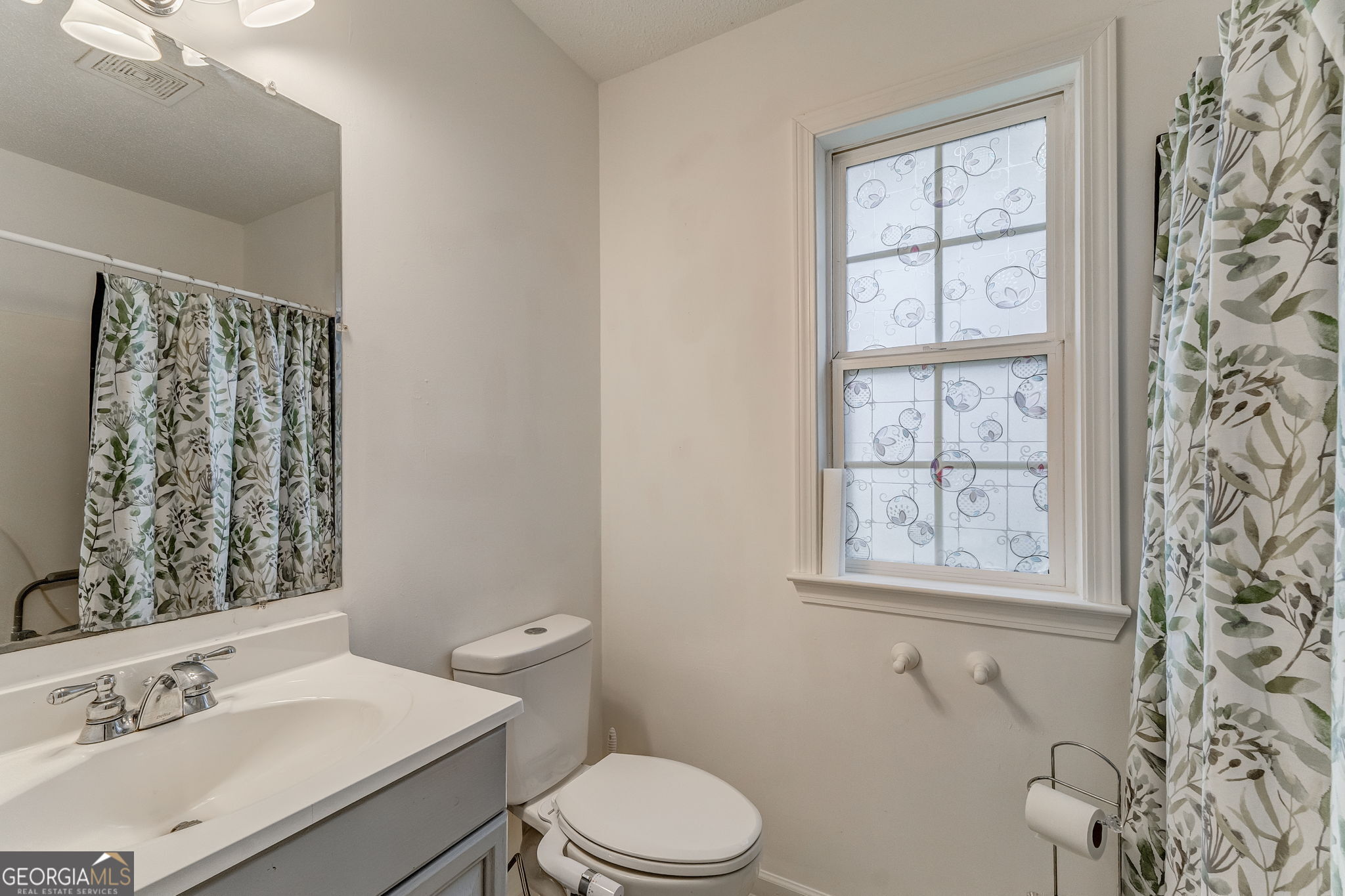 1 Green Acre Road Northeast Rome, GA 30165 - Photo 22 of 30 a bathroom with a sink toilet and window