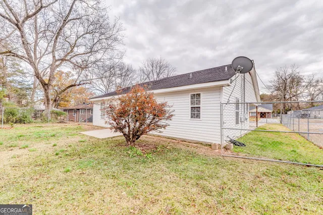 a view of a yard with snow on the road