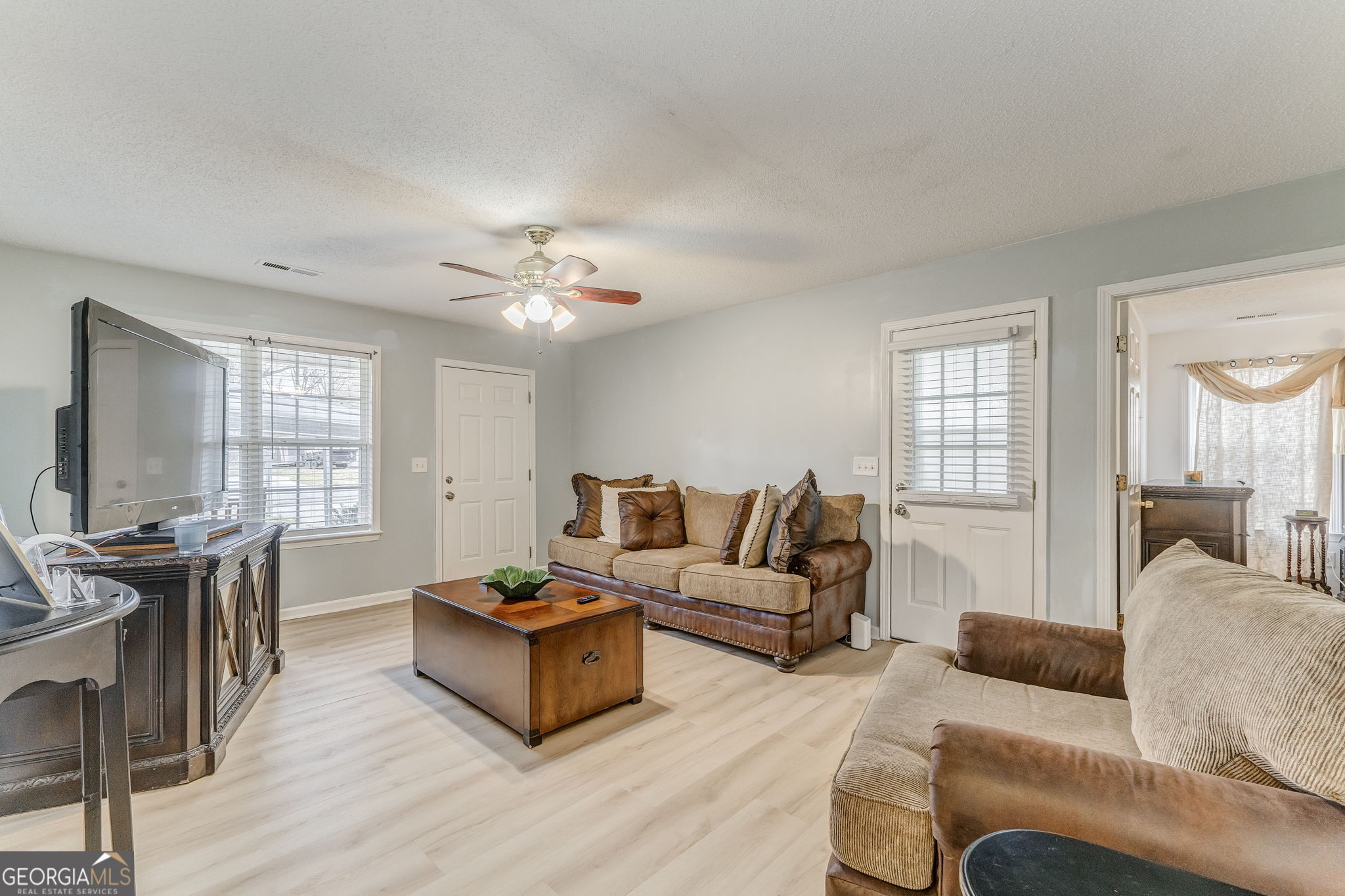 1 Green Acre Road Northeast Rome, GA 30165 - Photo 3 of 30 a living room with furniture a large window and a wooden floor