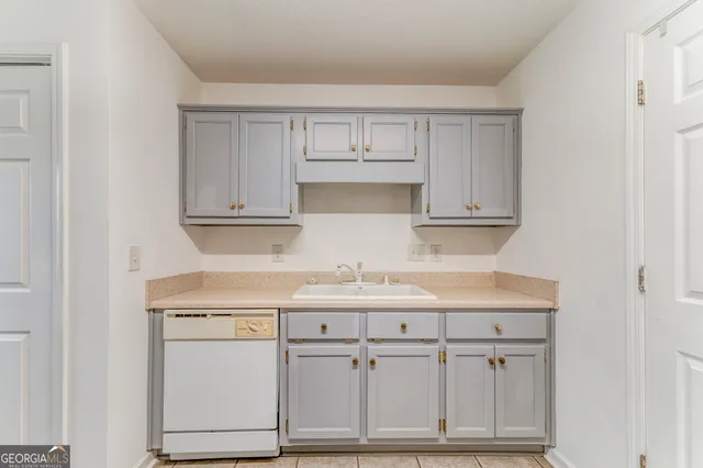 a kitchen with white cabinets