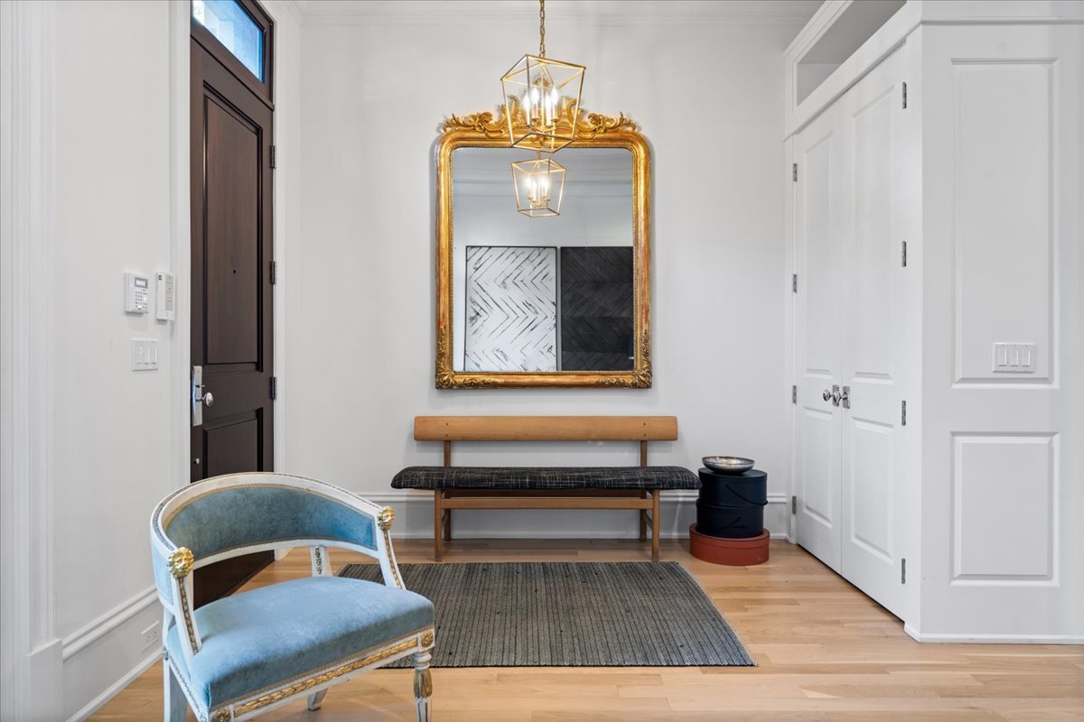 2633 North Dayton Street Chicago, IL 60614 - Photo 2 of 43 a view of a hallway that has a couch and a dining table with wooden floor
