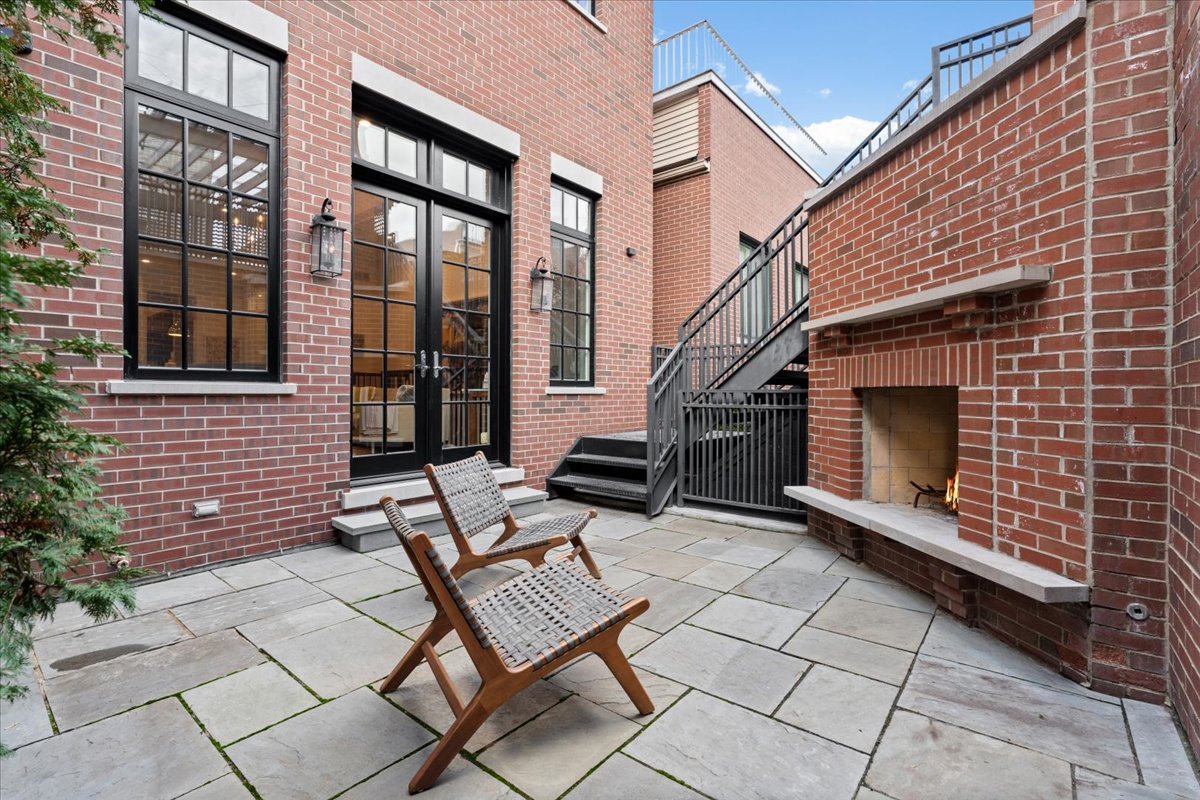 2633 North Dayton Street Chicago, IL 60614 - Photo 42 of 43 a backyard of a house with barbeque oven and a potted plant