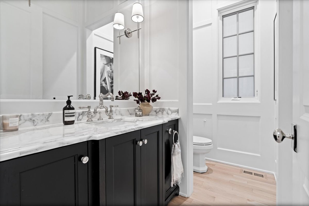 2633 North Dayton Street Chicago, IL 60614 - Photo 8 of 43 a bathroom with a double vanity sink toilet and mirror