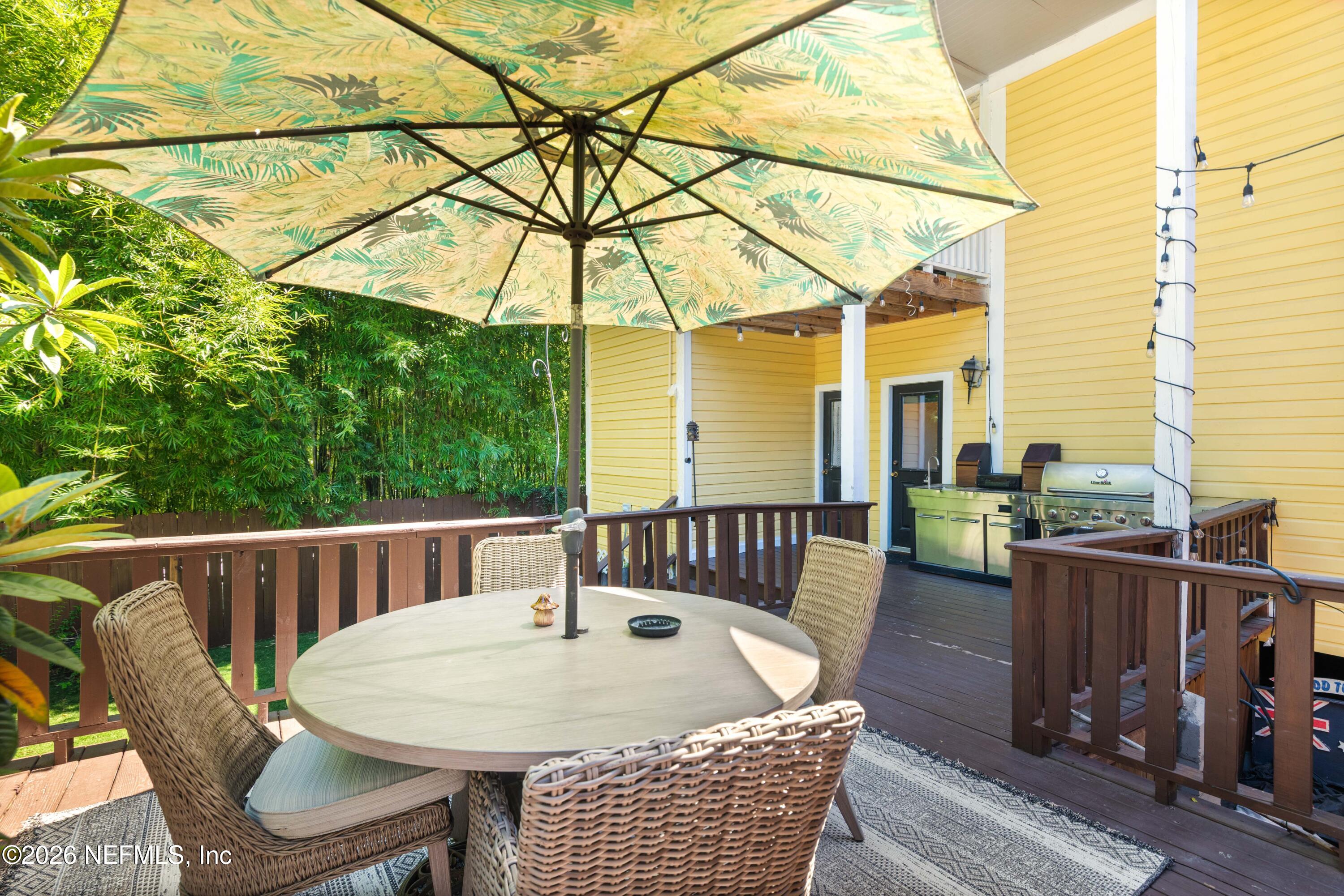 1138 Walnut Street Jacksonville, FL 32206 - Photo 19 of 37 a view of a chair and tables in the balcony