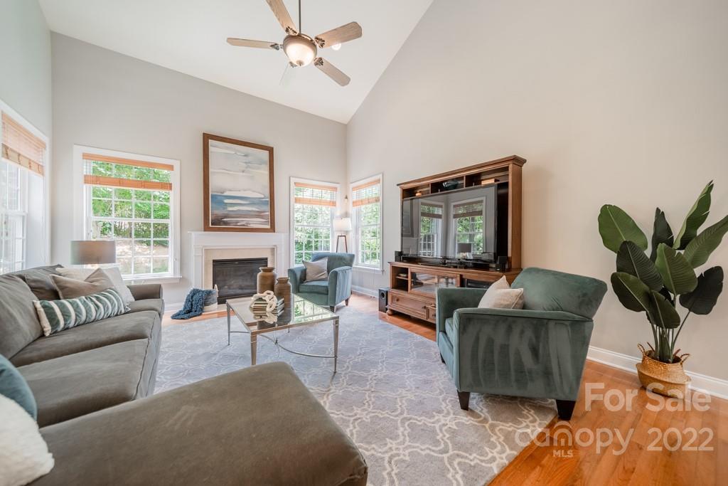 9622 Baileywick Road Charlotte, NC 28277 - Photo 16 of 39 a living room with furniture and a flat screen tv