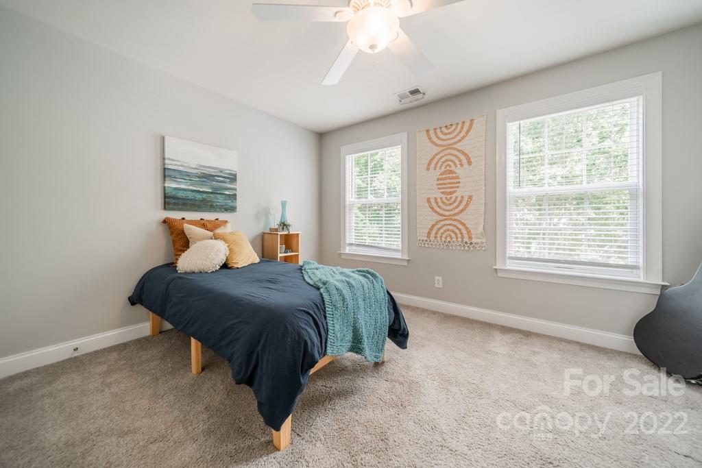 9622 Baileywick Road Charlotte, NC 28277 - Photo 21 of 39 a bedroom with a bed and window
