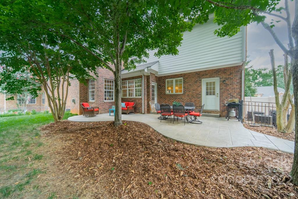 9622 Baileywick Road Charlotte, NC 28277 - Photo 34 of 39 a view of a house with a patio and a yard