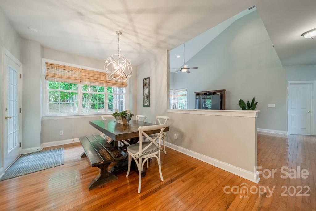 9622 Baileywick Road Charlotte, NC 28277 - Photo 10 of 39 a view of a dining room with furniture window and wooden floor
