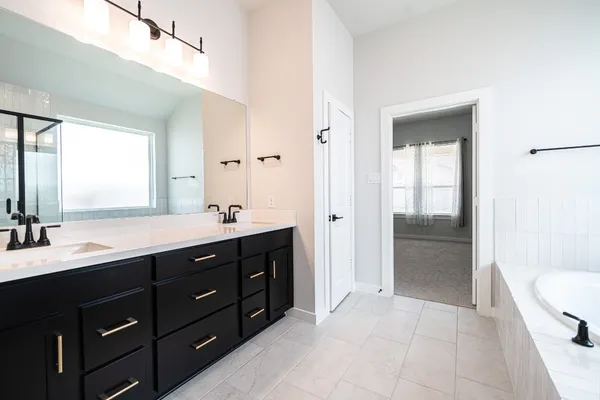 a bathroom with a bathtub and a shower