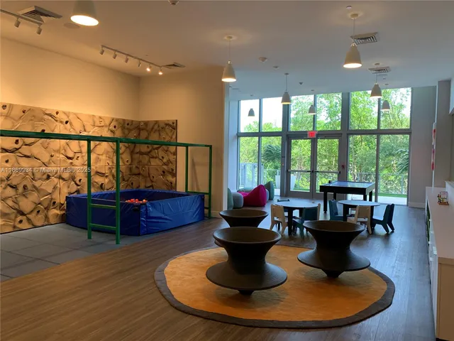 a dining room with furniture and a fireplace