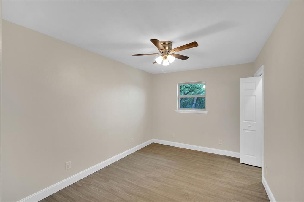 709 George Hopper Road Midlothian, TX 76065 - Photo 9 of 15 an empty room with a window and a fan