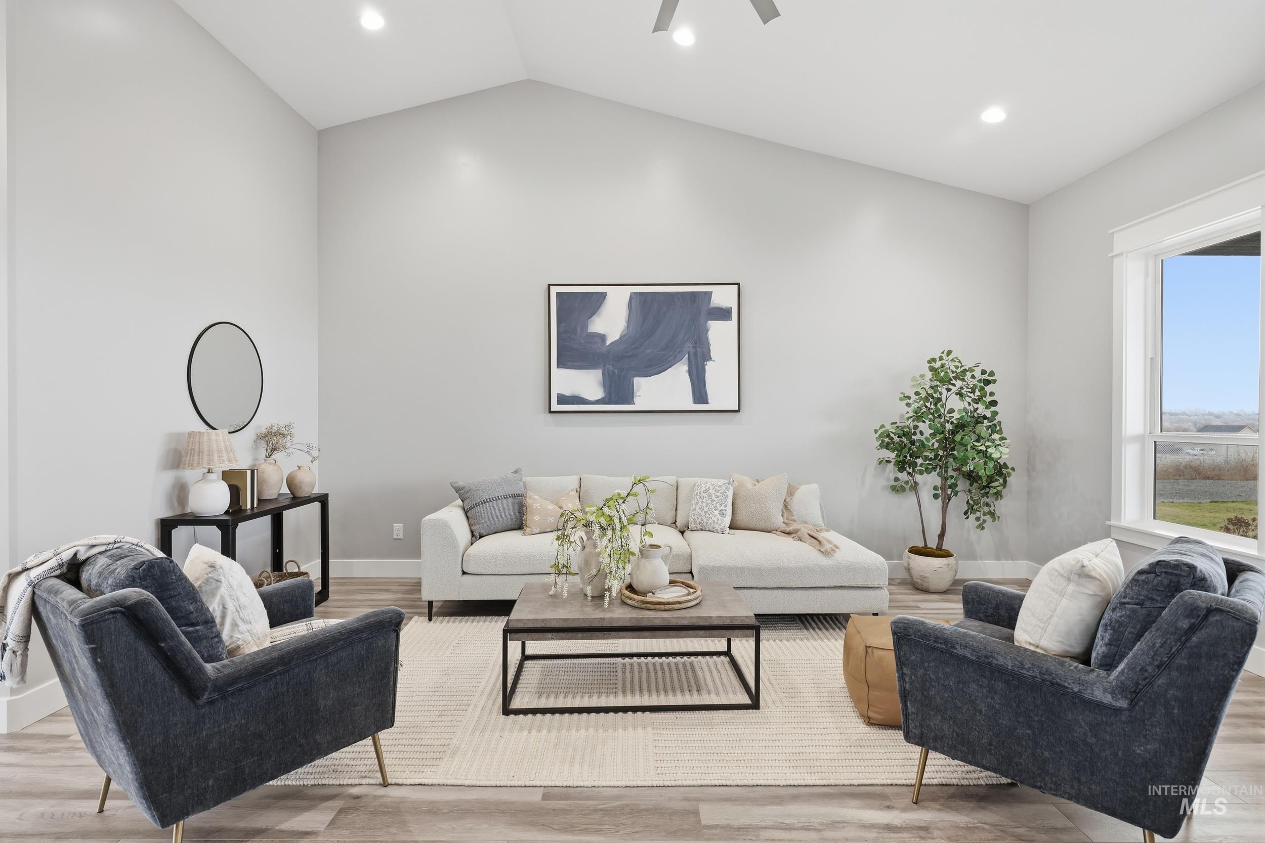 9264 Basin Kid Court Middleton, ID 83644 - Photo 15 of 50 Living area with lofted ceiling, recessed lighting, light wood finished floors, and a ceiling fan