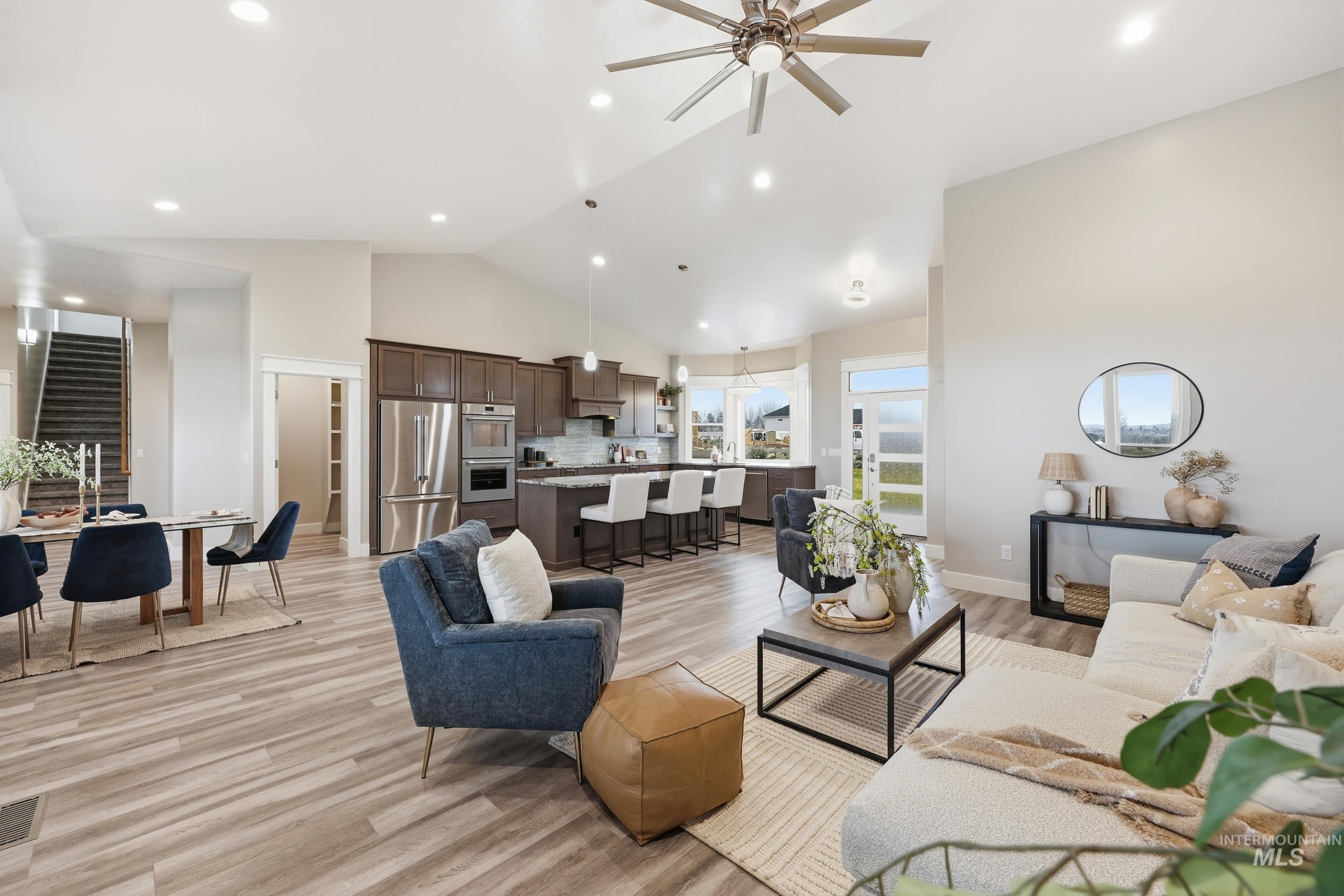 9264 Basin Kid Court Middleton, ID 83644 - Photo 2 of 50 Living area with light wood-style floors, a ceiling fan, recessed lighting, and high vaulted ceiling