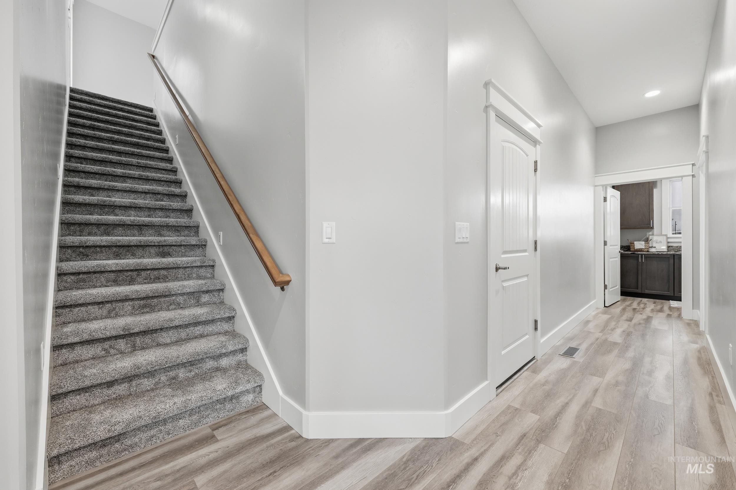 9264 Basin Kid Court Middleton, ID 83644 - Photo 23 of 50 Stairs with wood finished floors and recessed lighting